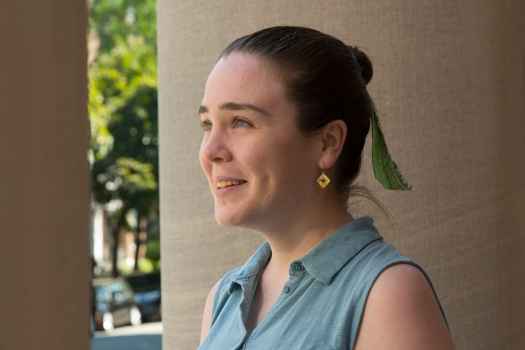 Participant Maria - person with dark hair tied back and wearing a blue tank top