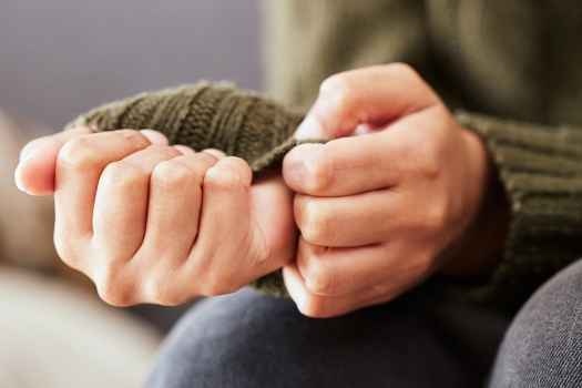 Person picking at hands