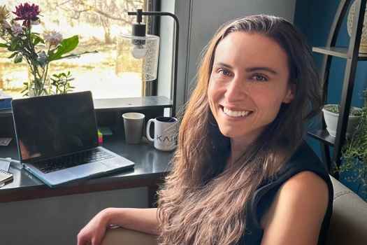 Participant Natalia - person with long brown hair sitting at a desk