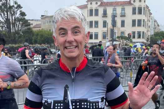 Participant Christy - person with short white hair smiling outside