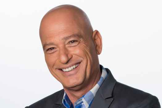 Participant Howie - person smiling in front of a white background