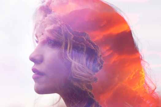 Photo montage of a head with clouds overlaid