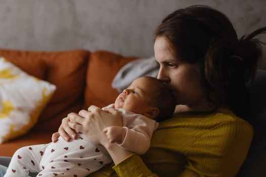 Mom holds baby