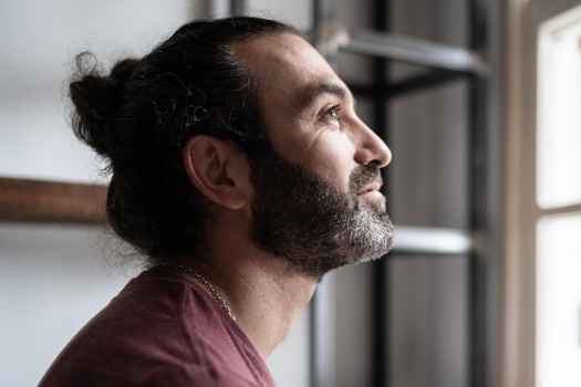 Contemplative person looks out window