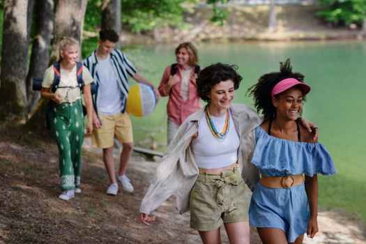 Group of teens walking at lake