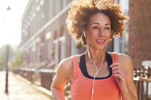 Person running outside in city neighborhood