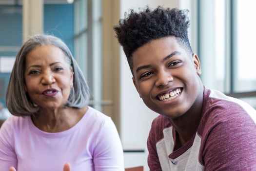 Teen boy and older woman in group therapy