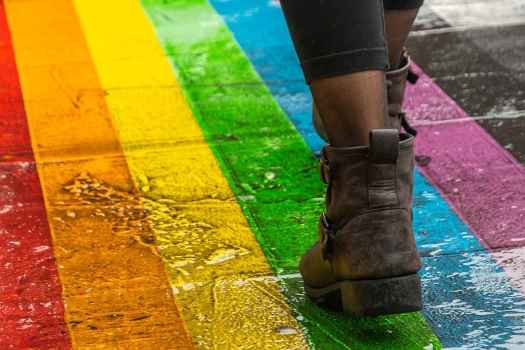 Walking on rainbow crosswalk