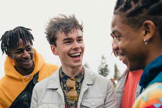 A group of teens laughing together