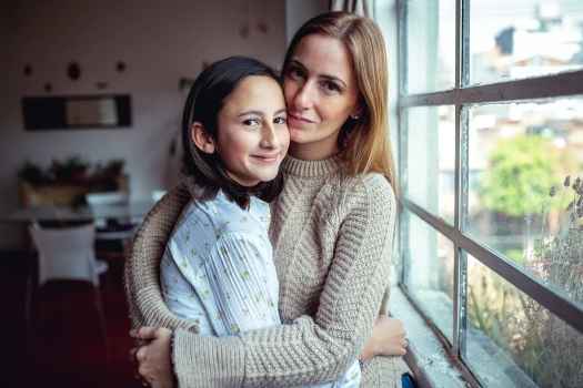 Mother and daughter hug