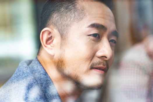 Man giving slight smile