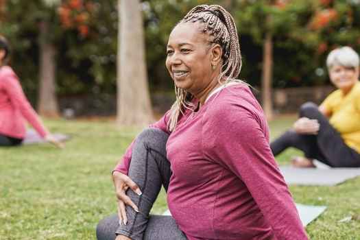 Women doing yoga outside