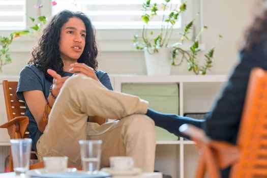 teen boy talking to a therapist