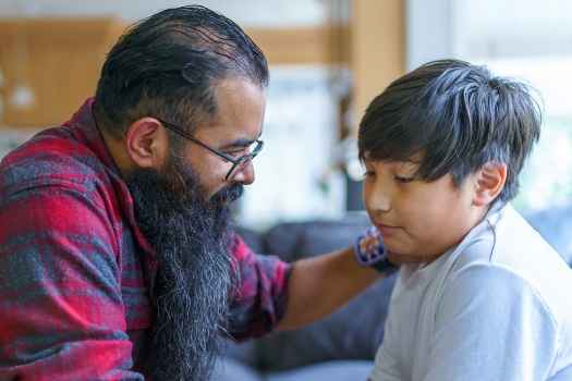 Man comforting a child