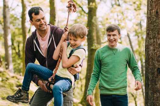 a family having fun in the woods