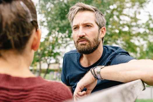 Parent talks with teen outside