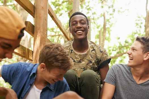 Teens laugh outside