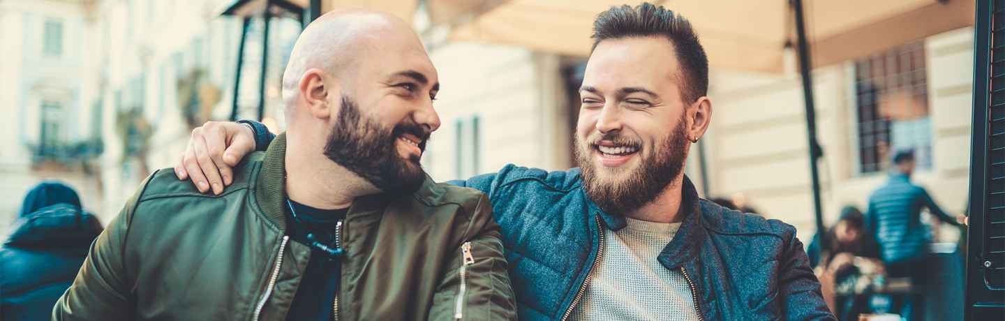 Two men hanging out on a porch