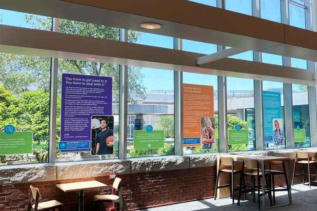 Window panels with Deconstructing Stigma posters