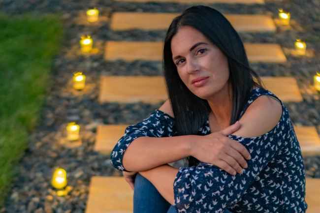 Participant Lisha - person with dark hair wearing a patterned shirt