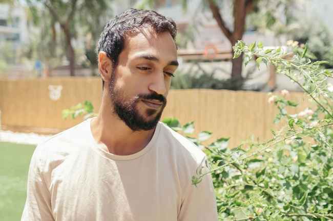 Deconstructing Stigma participant Neriya - person standing outside in garden