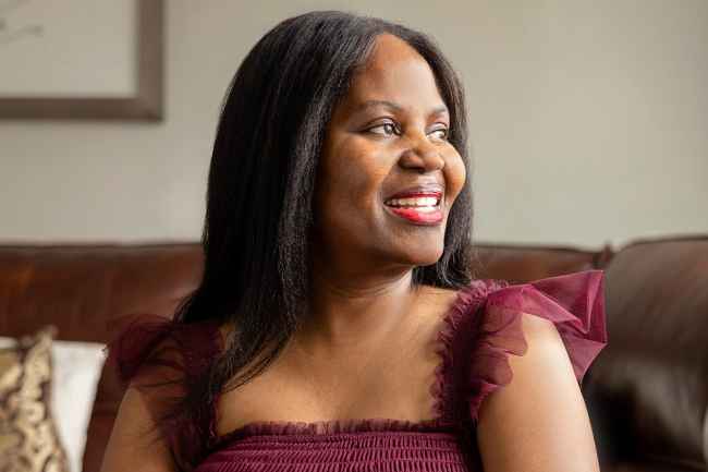 Deconstructing Stigma participant Dorothy - person sits on brown couch
