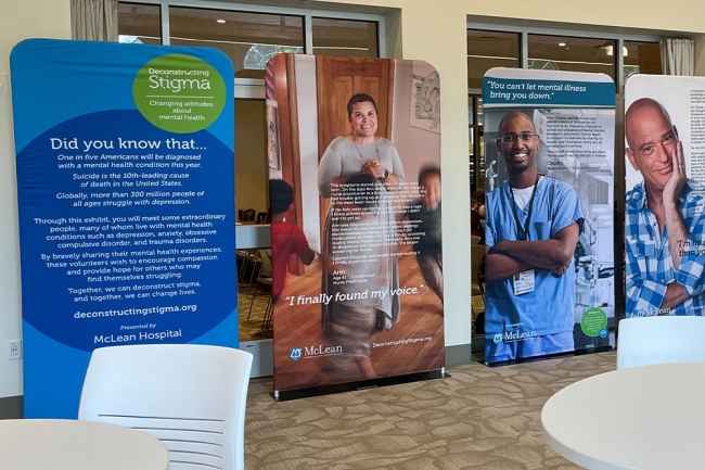 Display of images of people and text about their mental health journeys