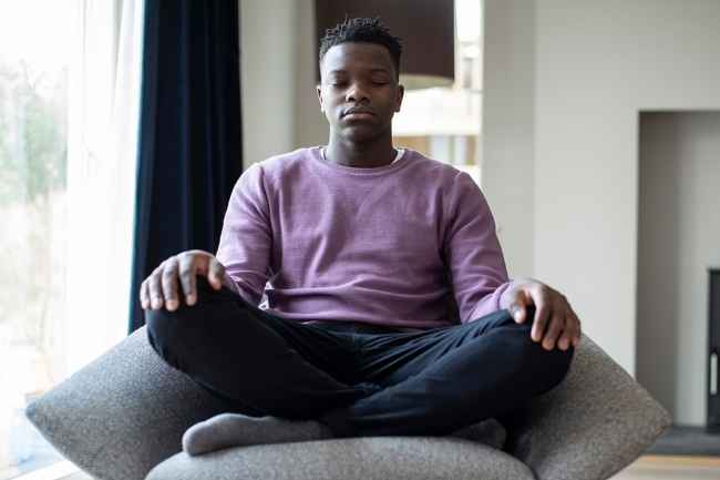 Young man sitting and meditating
