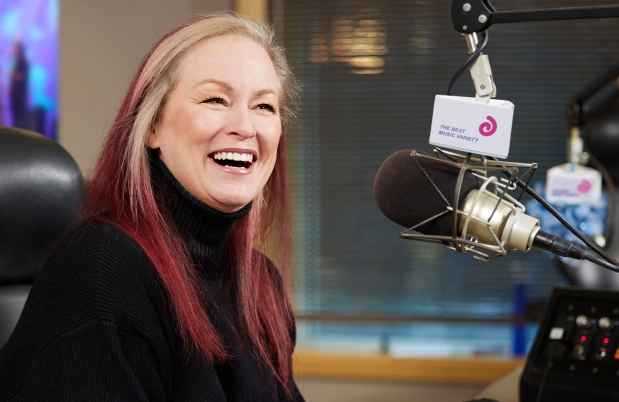 Participant Kennedy - person with blond hair dyed red on the ends surrounded by an audio recording setup