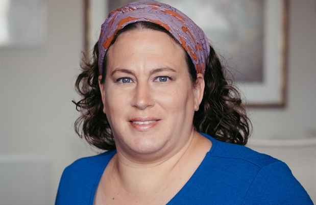 Deconstructing Stigma participant Judith - portrait of person with kerchief in hair, blue shirt