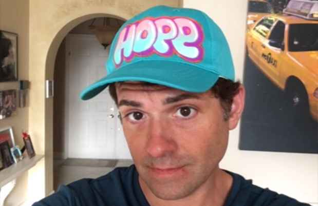 Participant David wearing a hat that says Hope