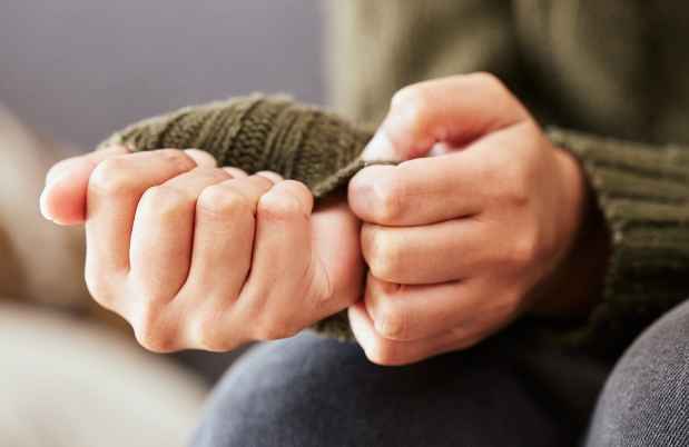 Person picking at hands