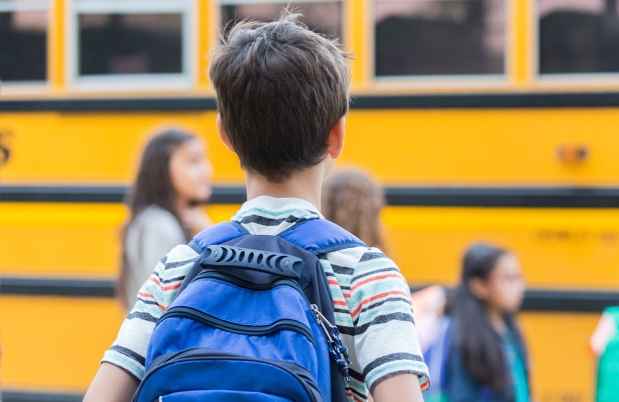 Kids in line for school bus