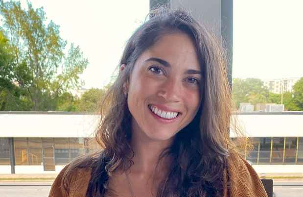 Participant Lilian sitting outdoors on a chair