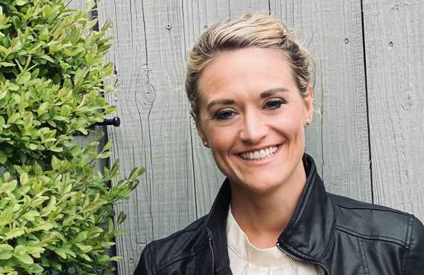 Participant Mandy - person with blond hair pulled back into an updo wearing a black leather jacket
