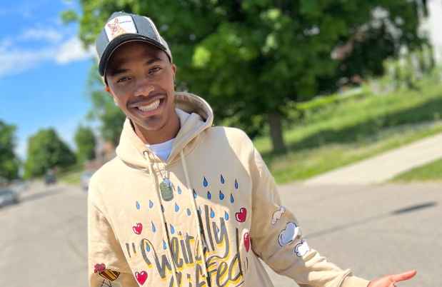 Participant Marquez - person wearing a yellow sweatshirt and a baseball hat