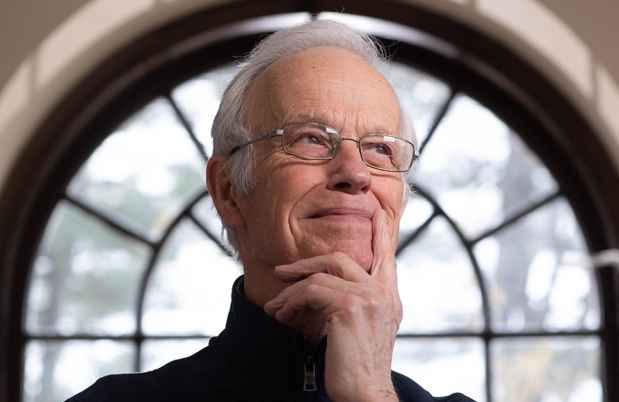 Participant Robert - person with short white hair and glasses in front of a window