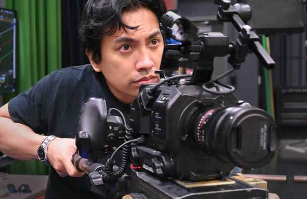 Participant Rodney - person with dark hair holding a video camera