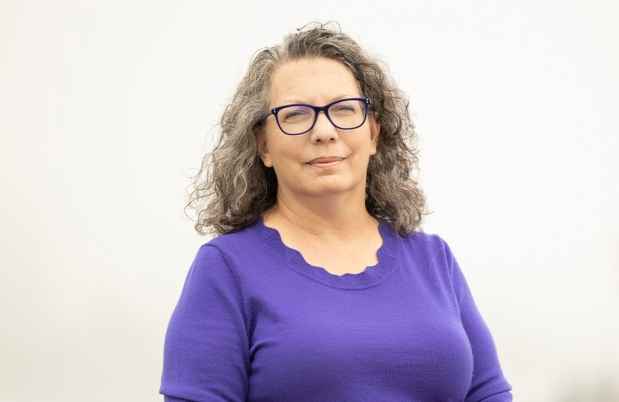 Participant April - woman with purple shirt, glasses