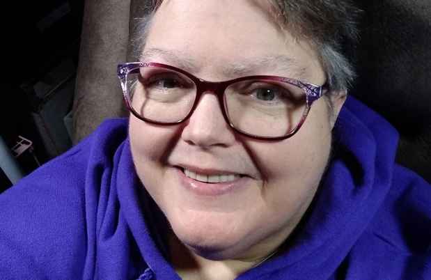 Participant Shirley smiling wearing glasses