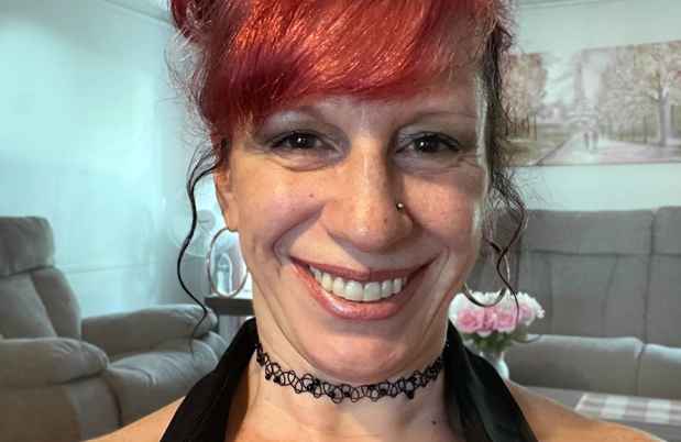 Participant Sandy with red hair smiling