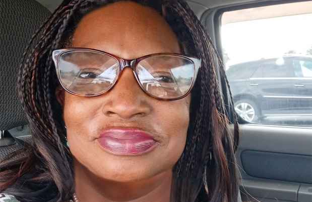 Participant Sylvia sitting in a car wearing glasses