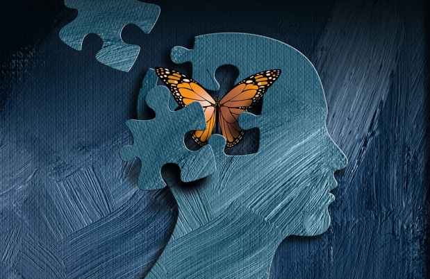 Graphic of a head with a puzzle piece missing and a butterfly flying out