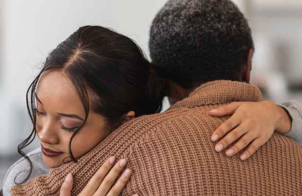 Young person hugging someone