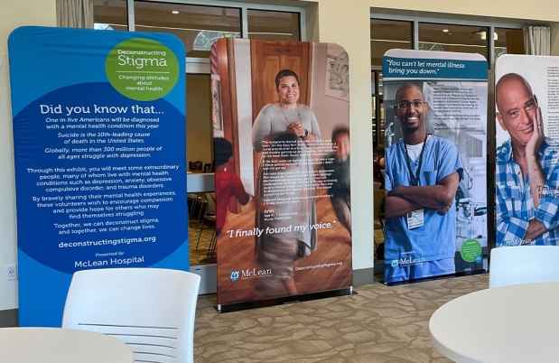 Display of images of people and text about their mental health journeys