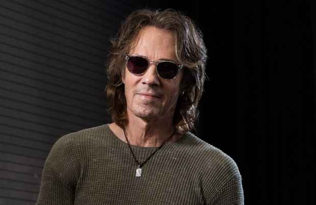 Deconstructing Stigma participant Rick - person in sunglasses in dark room