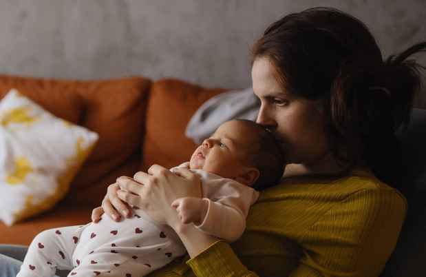 Mom holds baby
