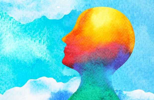 Graphic of a multicolor head on a cloud background, watercolor vibe