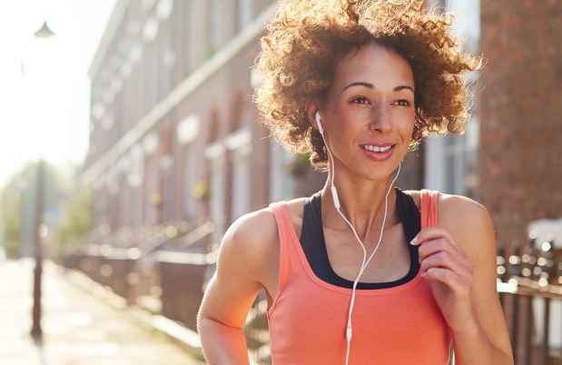Person running outside in city neighborhood