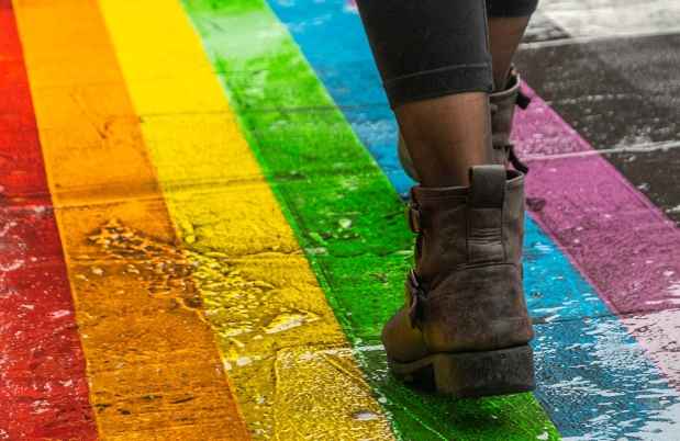Walking on rainbow crosswalk